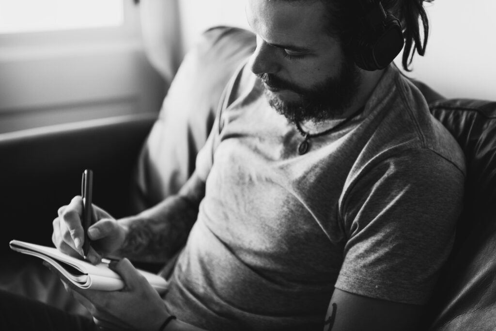 caucasian man in a songwriting process music concept caucasian man in a songwriting process music concept