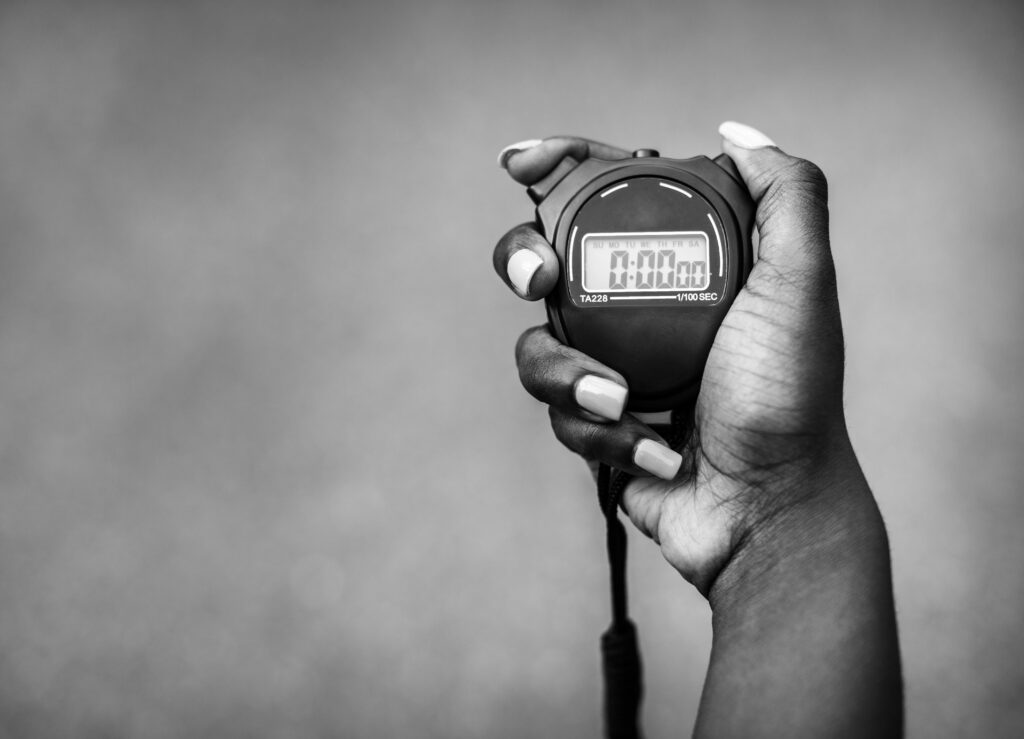 hand holding a stopwatch