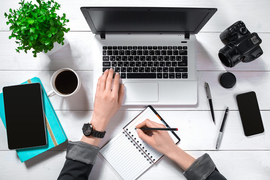 overhead view of businesswoman working at computer in office