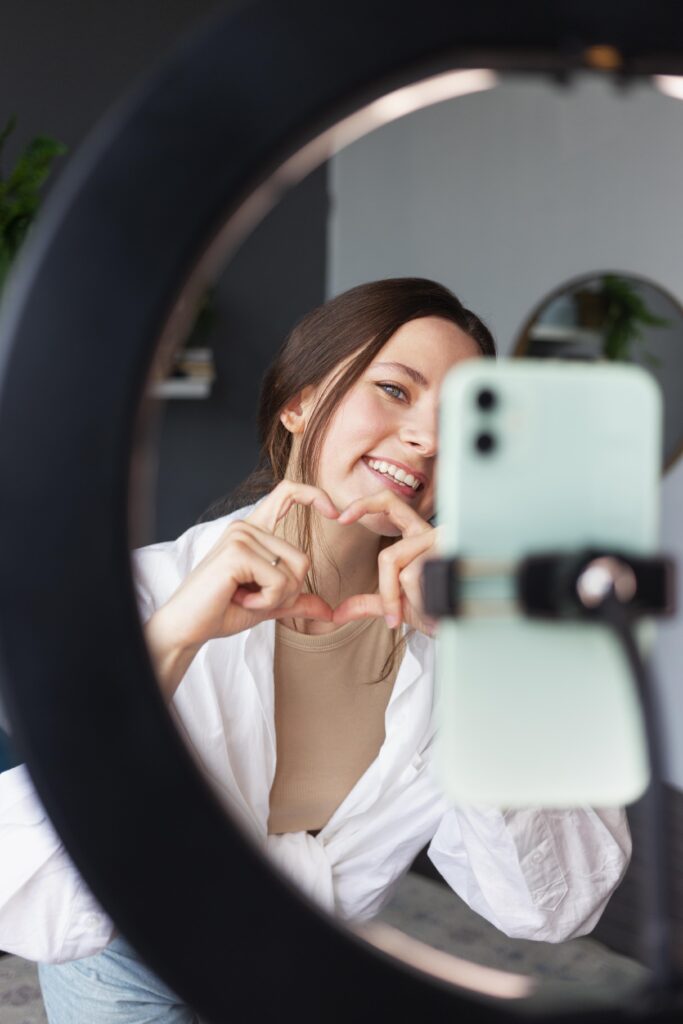 young woman making fun vlog